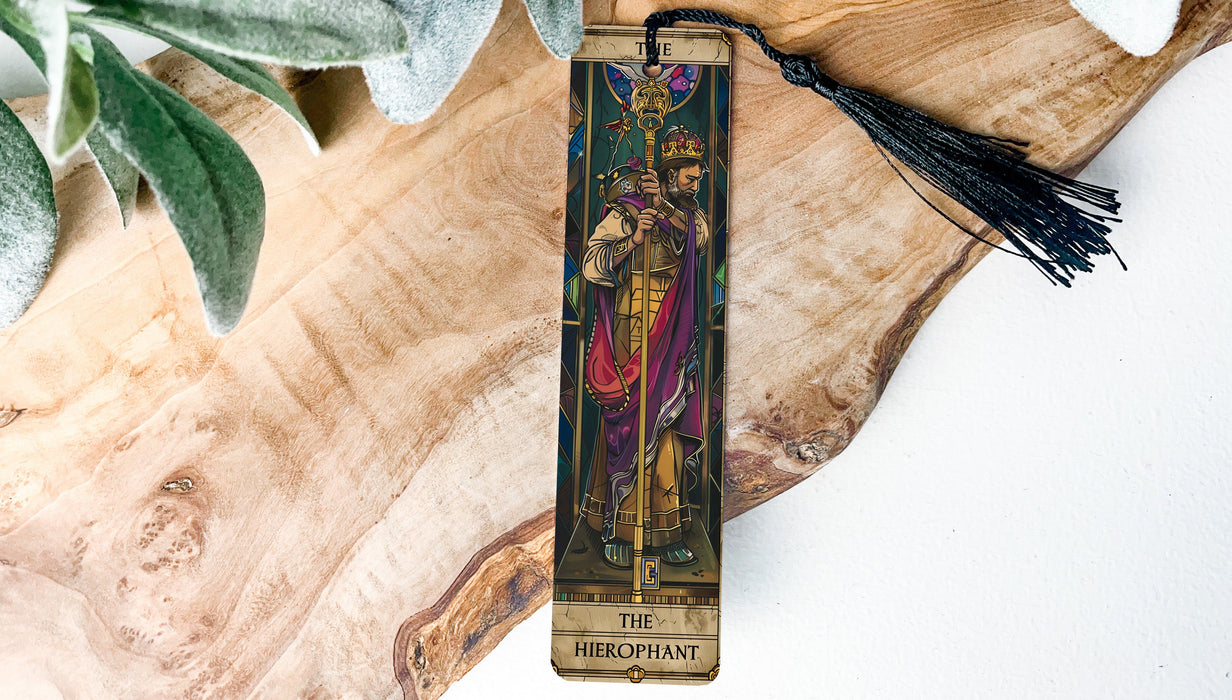 a cross with a tassel hanging from it