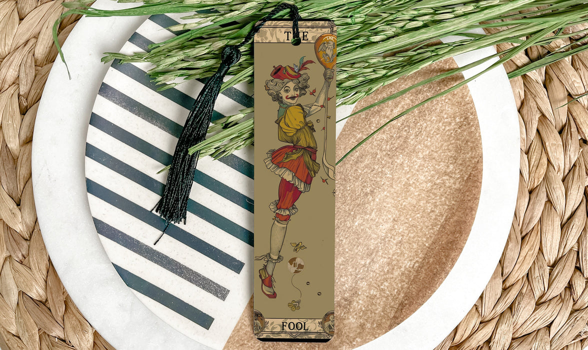 a bookmark sitting on top of a white plate