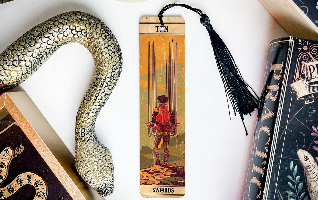 a bookmark with a picture of a boy and a snake on it
