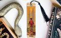 a bookmark with a picture of a boy and a snake on it
