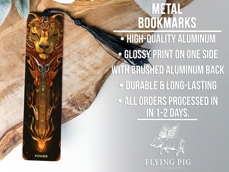 a metal bookmark with a lion head on it