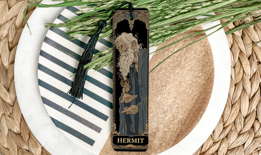 a plate with a bookmark and a plant on it