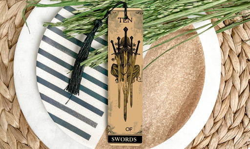 a bookmark on a plate with a plant on it