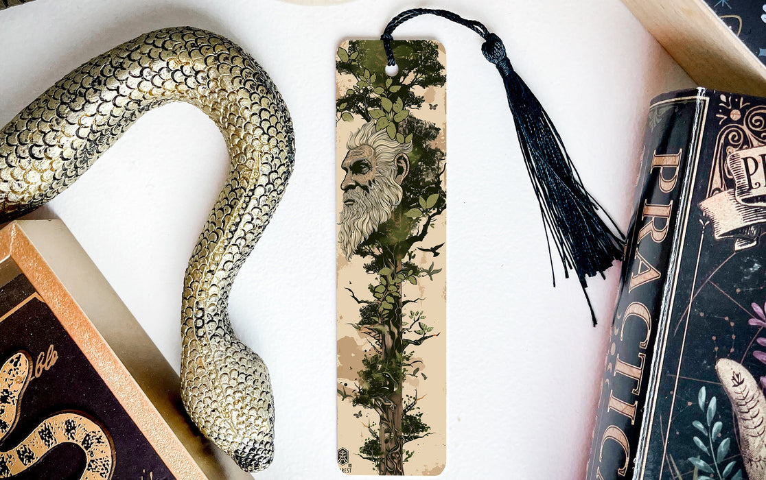 a snake, a bookmark, and some books on a table