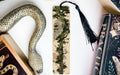 a snake, a bookmark, and some books on a table