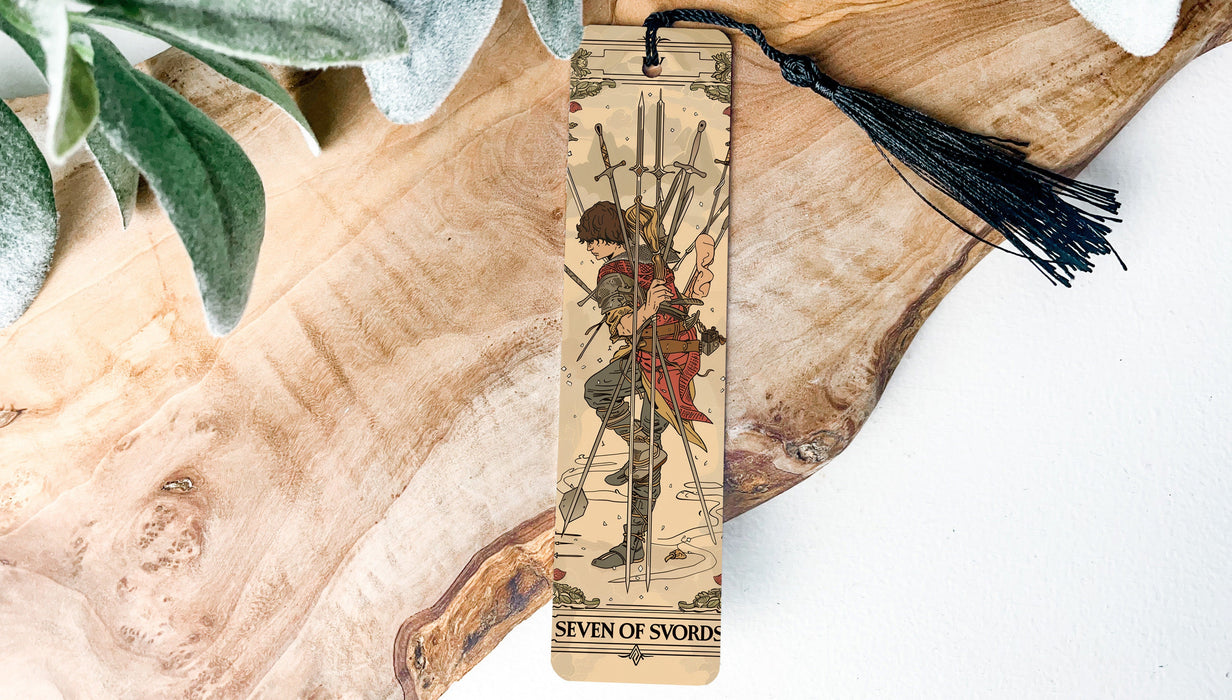 a bookmark with a picture of a woman holding a sword