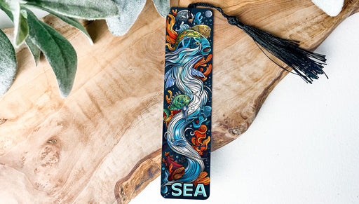 a wooden board with a tassel on top of it