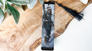 a bookmark with a picture of a man holding a sword
