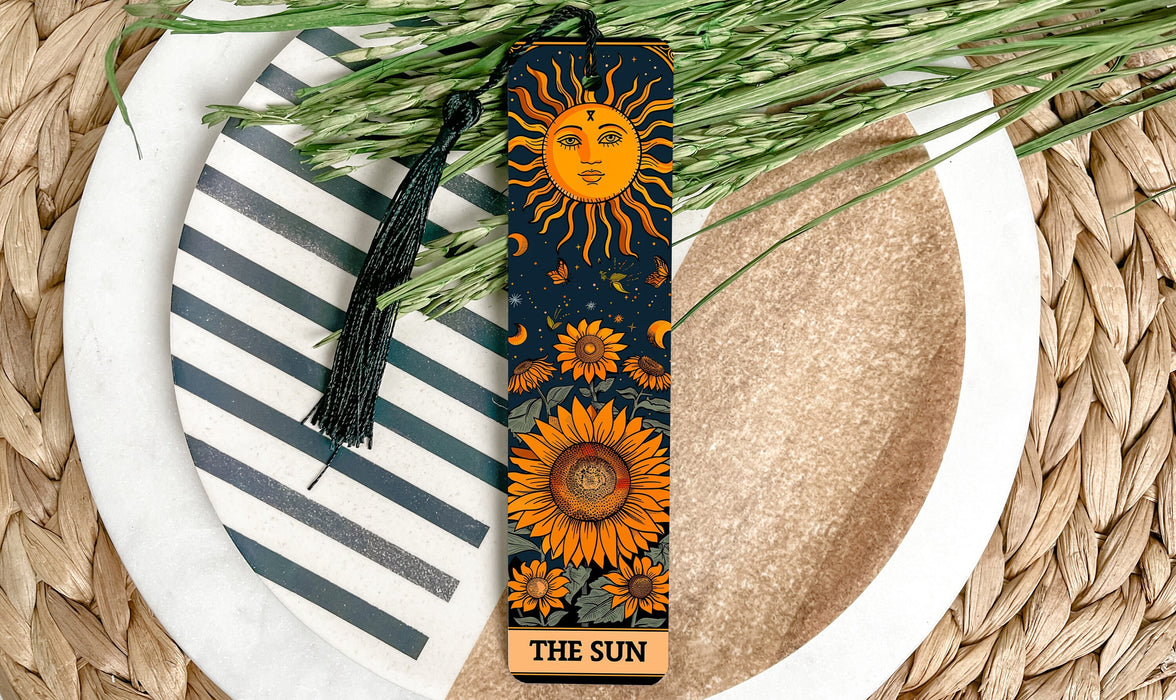 a bookmark with a picture of a sun on it