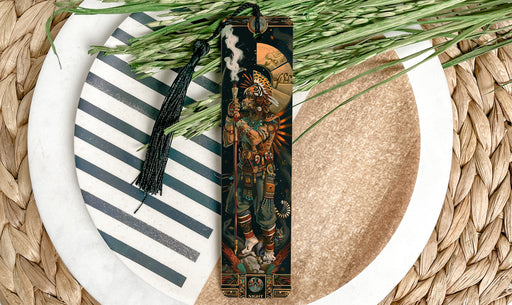 a decorative bookmark on a plate with a plant