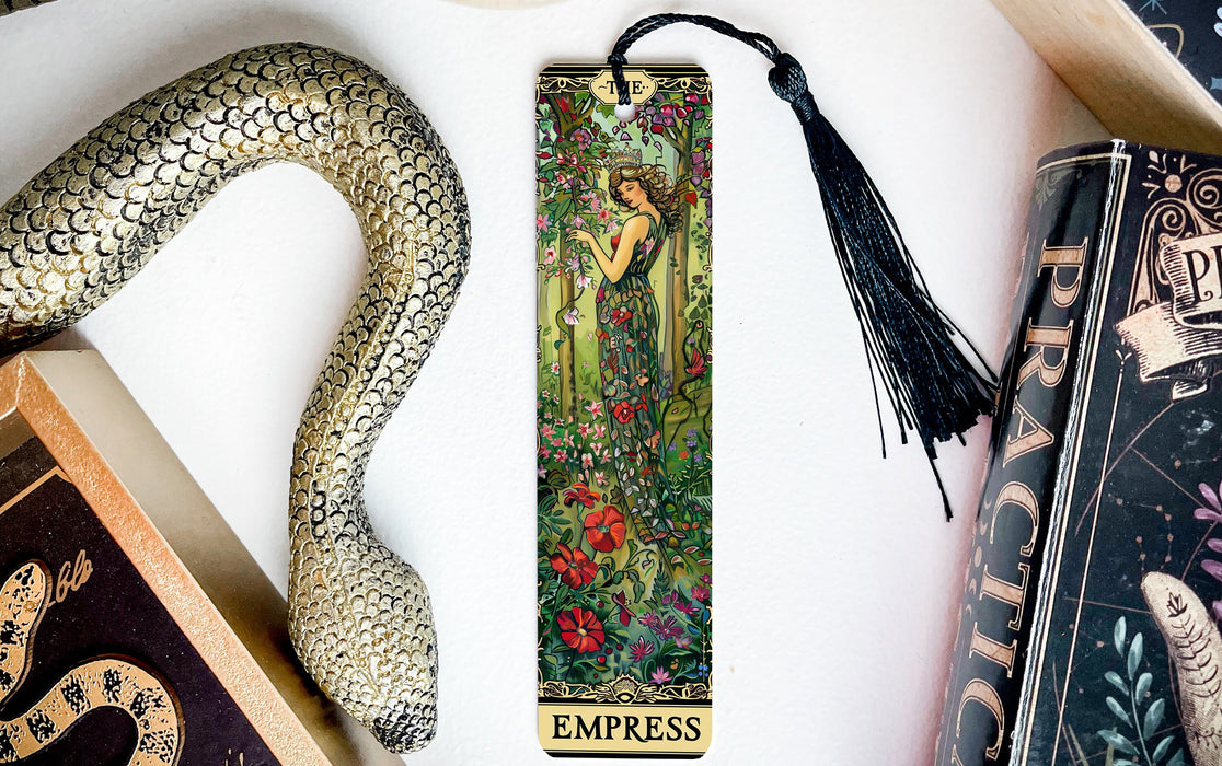 a bookmark with an image of a woman and a snake on it