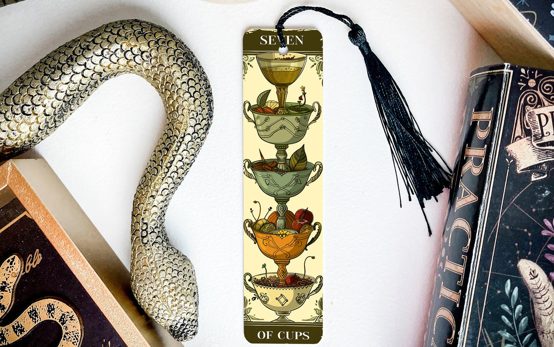 a bookmark with an image of a cup of tea and a snake