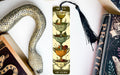 a bookmark with an image of a cup of tea and a snake