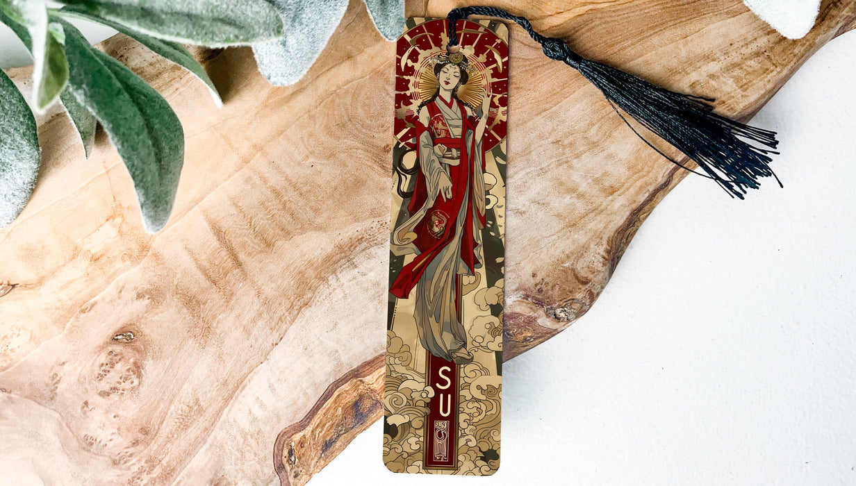 a wooden cross with a tassel hanging from it