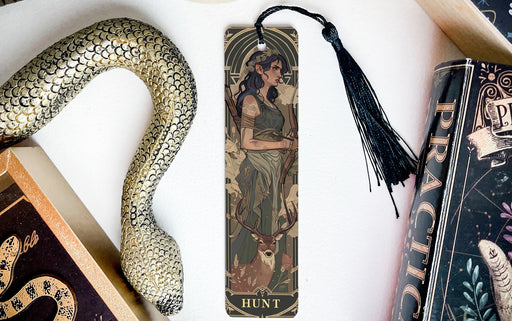 a bookmark with a picture of a woman and a snake on it