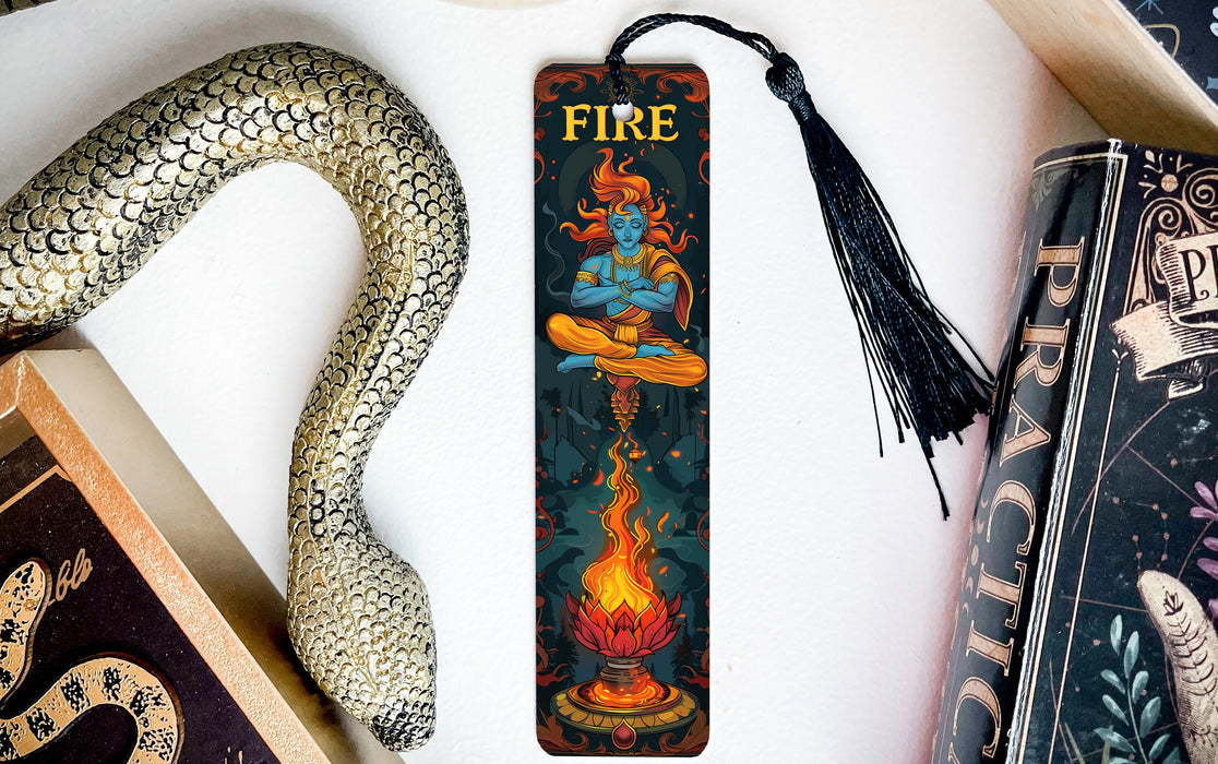 a bookmark with a fire on it next to a snake