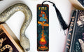 a bookmark with a fire on it next to a snake