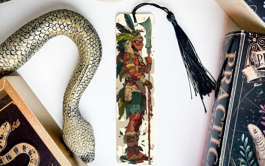 a snake, a bookmark, and some books on a table