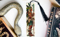 a snake, a bookmark, and some books on a table