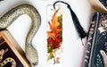 a bookmark with a picture of a leaf on it