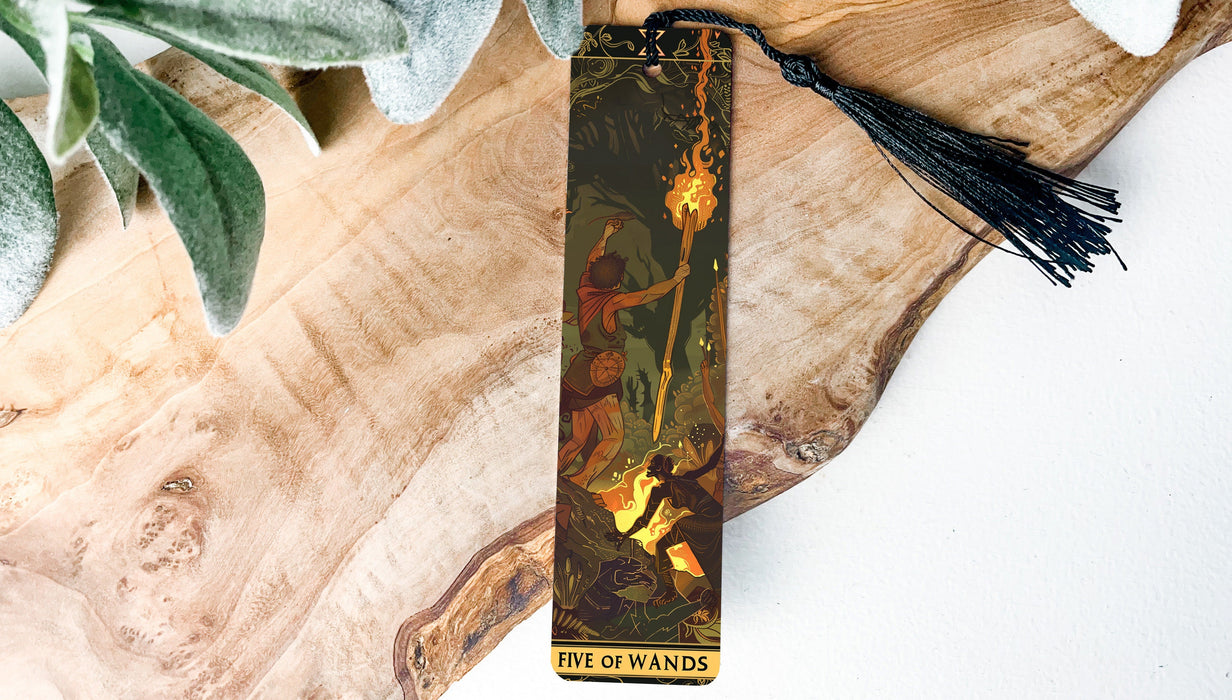 a bookmark with a painting of a man on a tree branch
