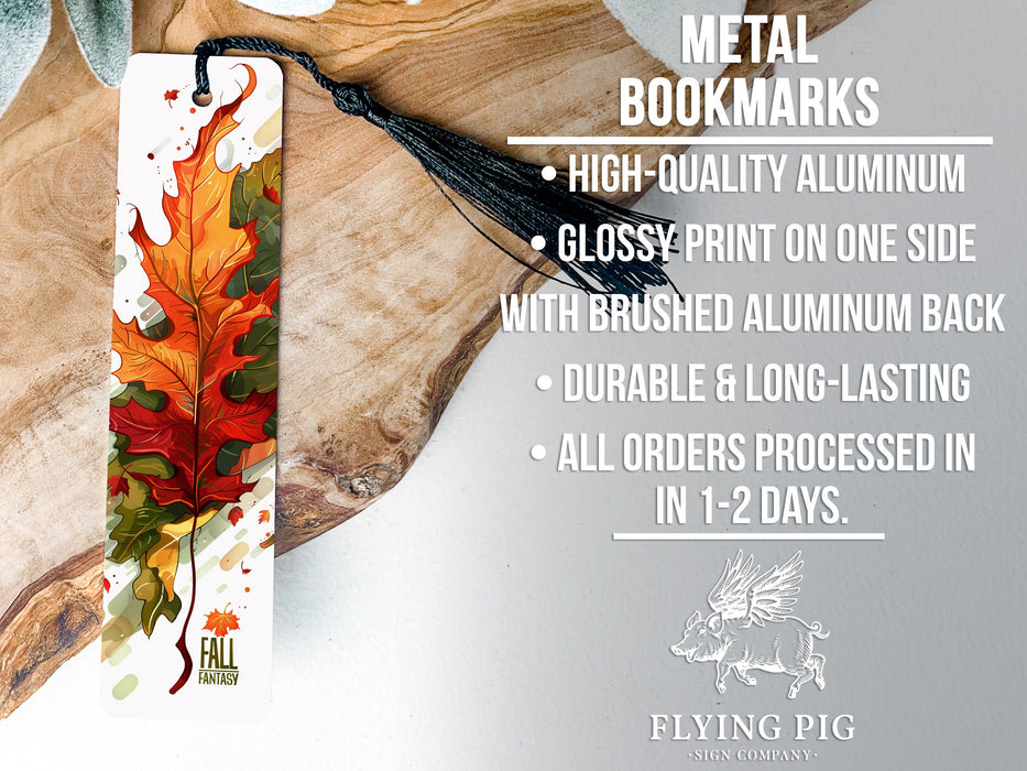 a metal bookmark with a leaf design on it