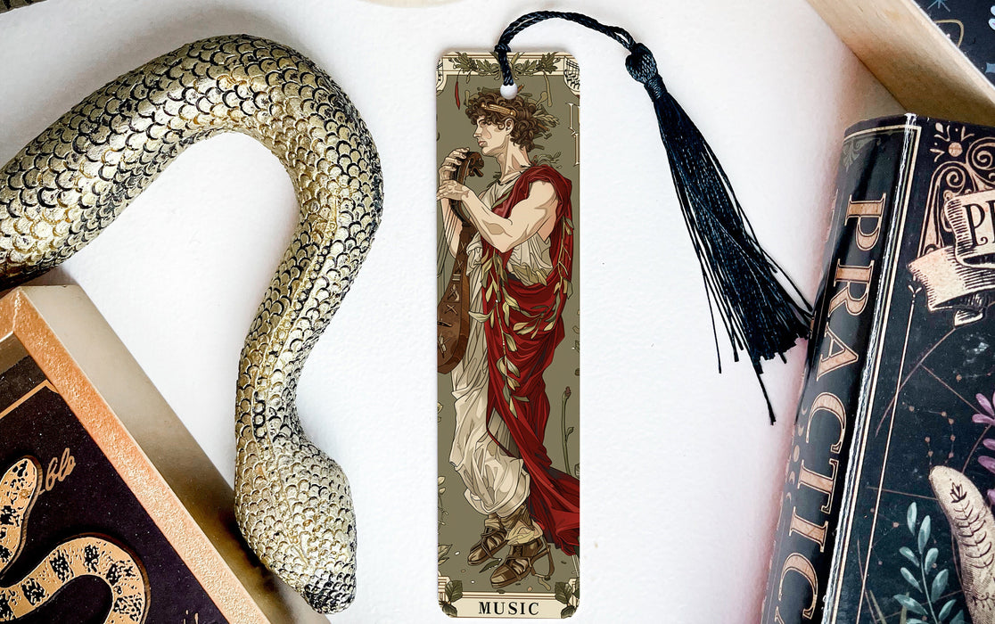 a bookmark with a picture of a woman holding a snake