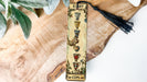 a bookmark with a tassel hanging from it