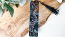 a bookmark with a picture of a mermaid on it