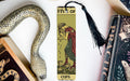 a bookmark with a picture of a woman holding a snake