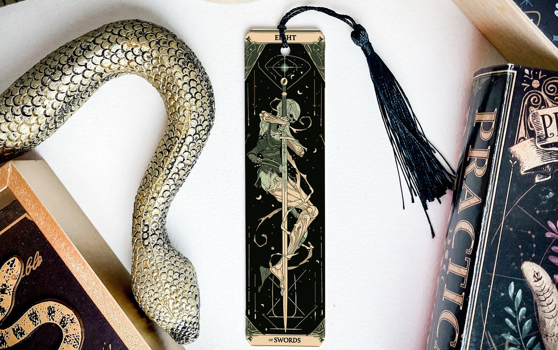 a bookmark with a snake and a snake on it