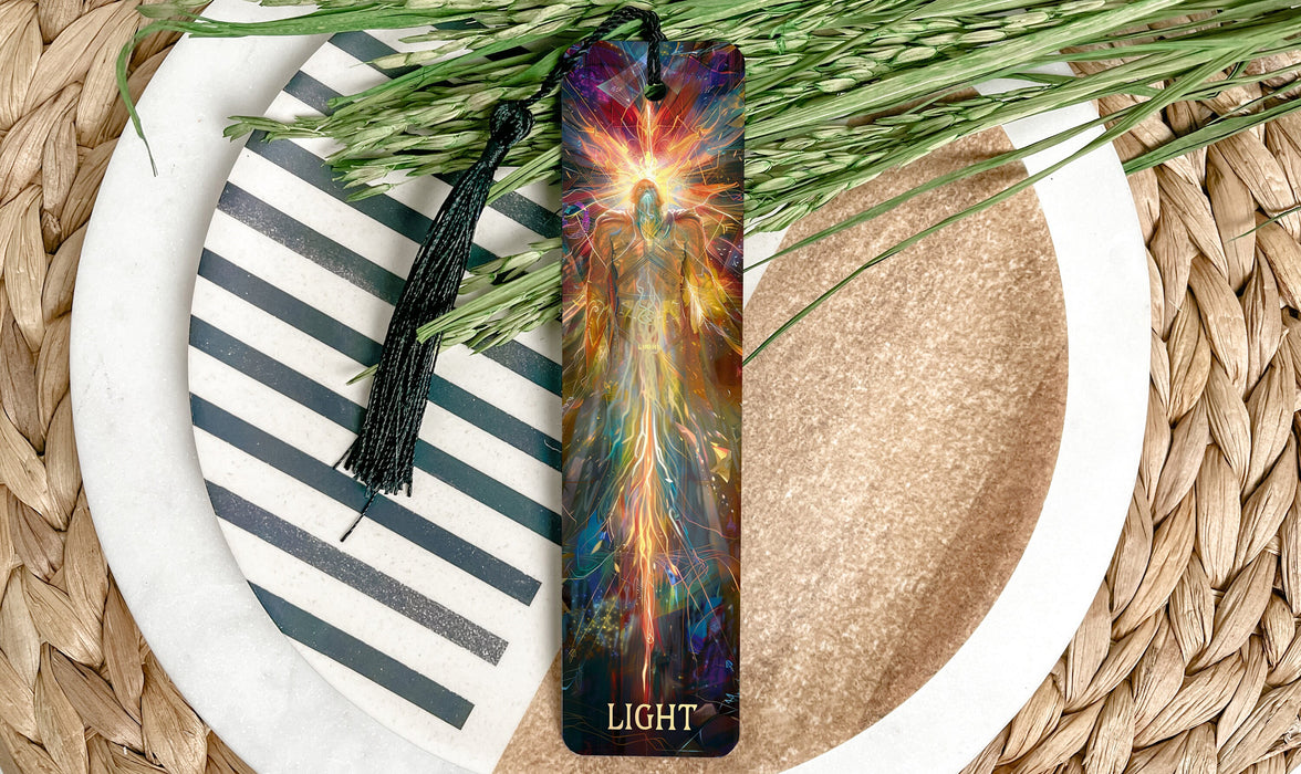 a bookmark on a plate next to a plant