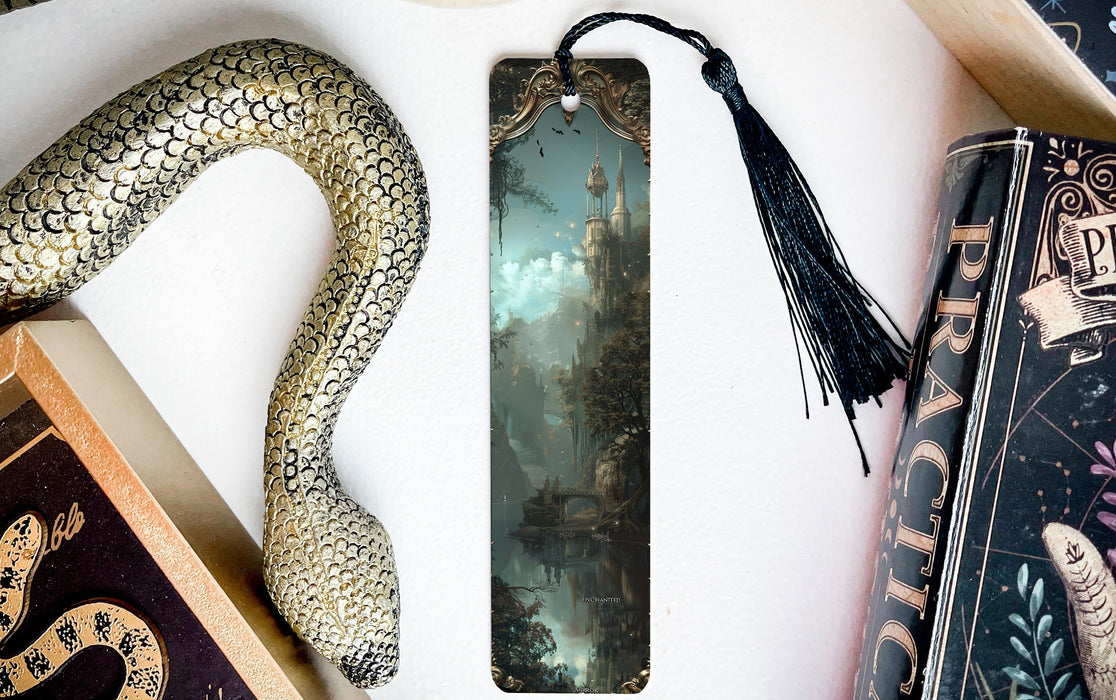 a bookmark with a snake and a book on it