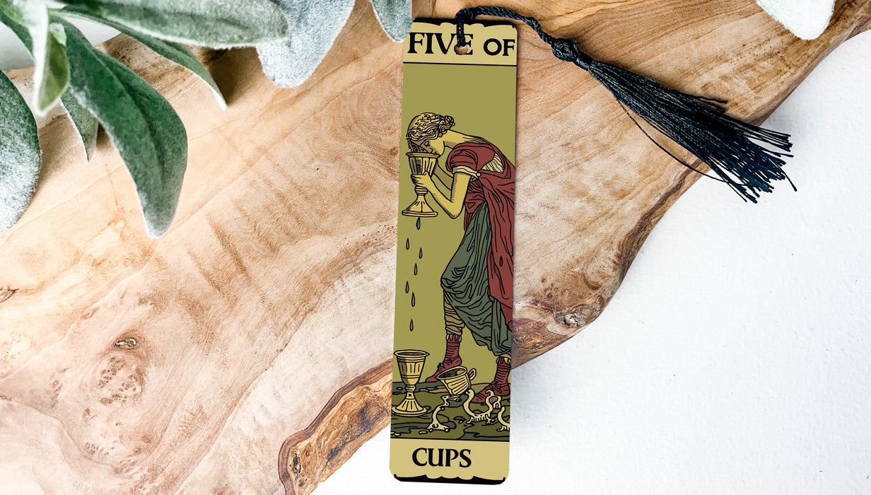 a bookmark with a picture of a woman holding a cup