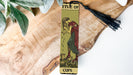 a bookmark with a picture of a woman holding a cup