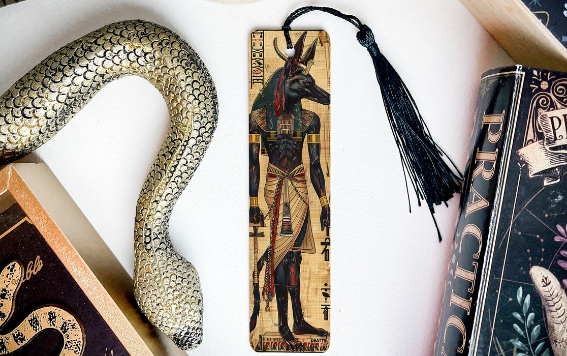 a bookmark, snake, and other items on a table