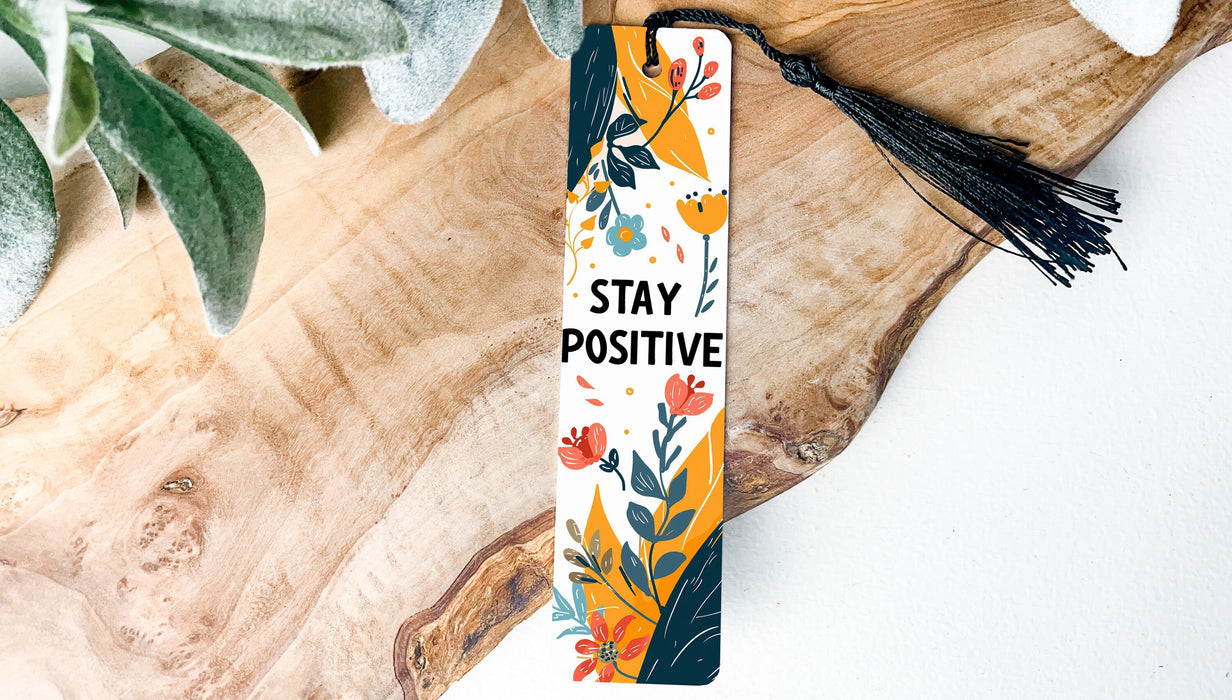 a bookmark that says stay positive on it