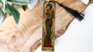a wooden cross with a picture of a woman on it