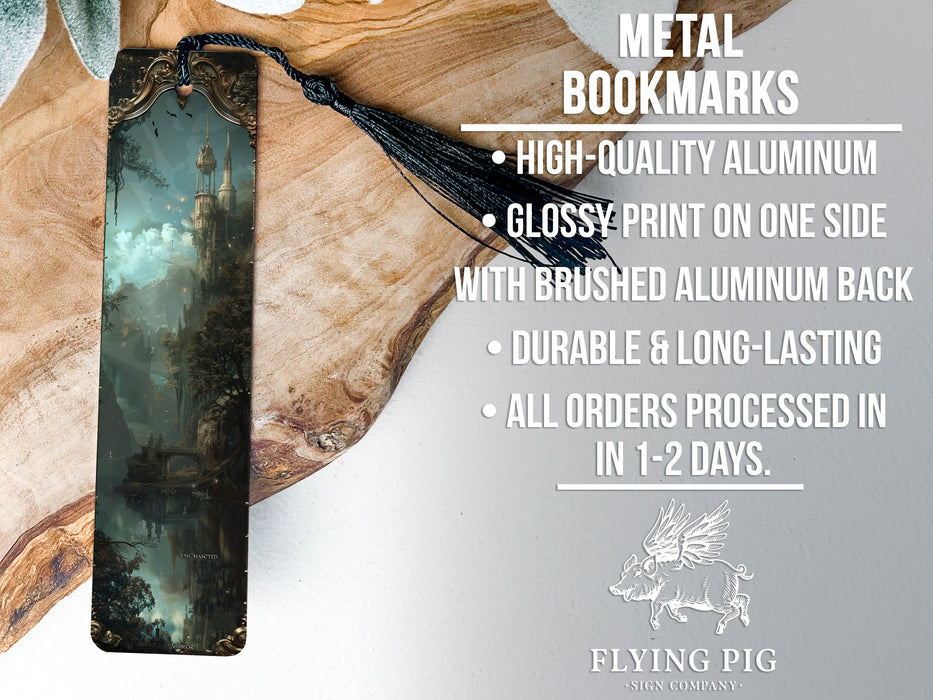 a metal bookmark with a forest scene on it
