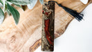 a bookmark with a picture of a woman holding a flower