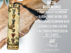 a metal bookmark with a tassel hanging from it