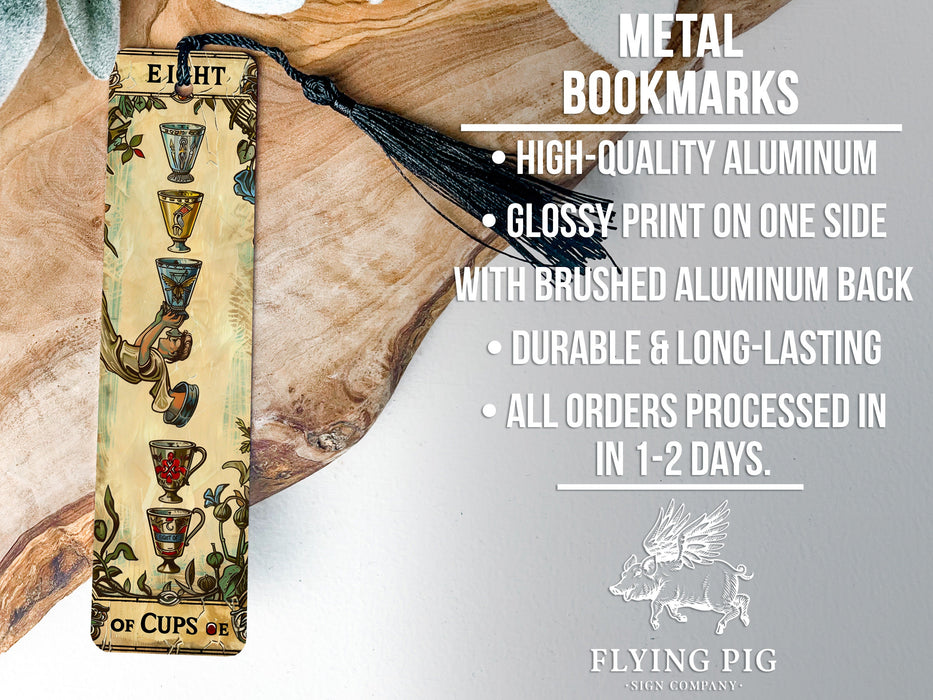 a metal bookmark with a tassel hanging from it