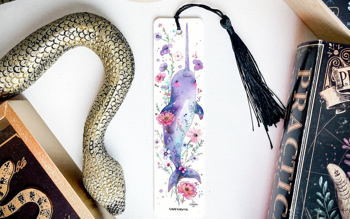 a bookmark with a snake and flowers on it