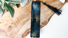 a piece of wood with a tassel on top of it
