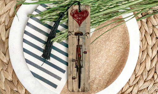 a bicycle is on a plate next to a plant