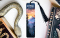 a bookmark with a picture of a mountain scene