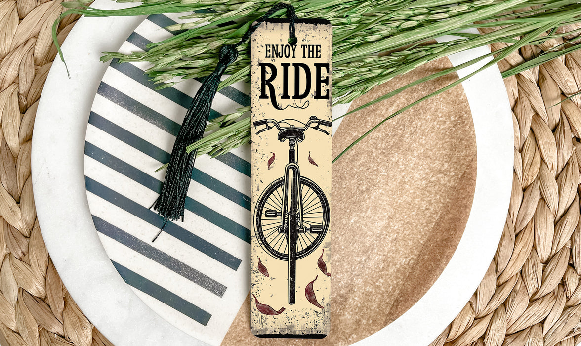 a bookmark with a bike on it sitting on a plate
