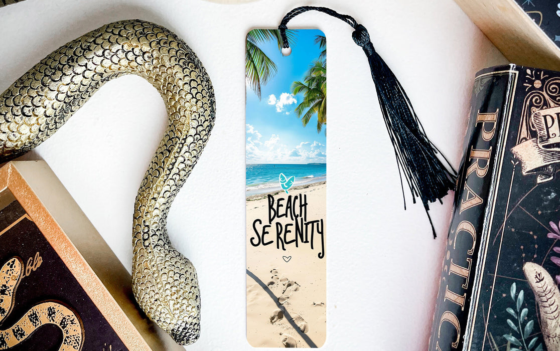 a bookmark with a picture of a beach and a snake on it