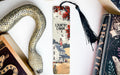 a snake, a bookmark, and a book on a table