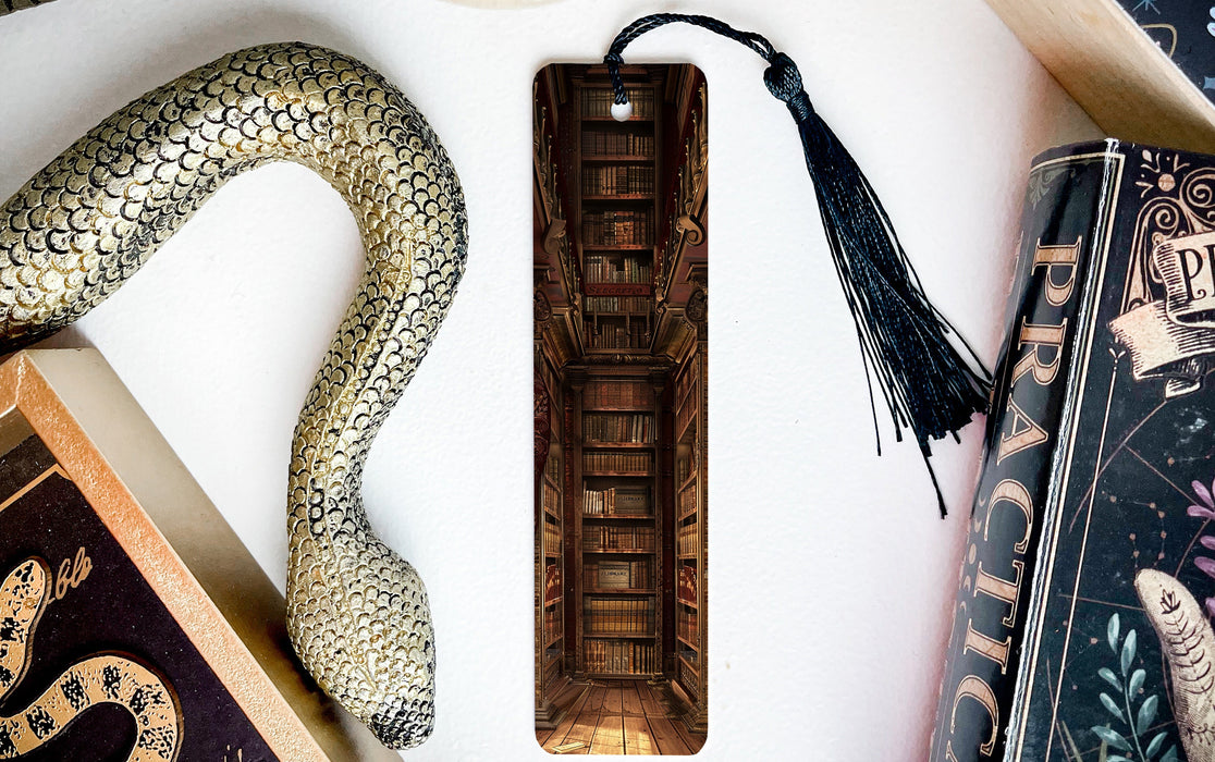 a snake, books, and a bookmark on a table